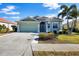 Single-Gathering home with a green exterior and tile roof at 1840 Bobcat Trl, North Port, FL 34288