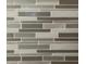 Modern kitchen backsplash with grey and white tiles at 18506 Klingler Cir, Port Charlotte, FL 33948