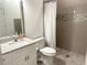 Modern bathroom with shower, toilet and granite vanity at 18506 Klingler Cir, Port Charlotte, FL 33948