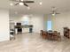 Modern kitchen with stainless steel appliances and adjacent dining area at 18506 Klingler Cir, Port Charlotte, FL 33948