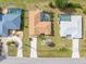 Aerial view of home with screened-in pool, patio, and other homes nearby at 2149 Rio De Janeiro Ave, Punta Gorda, FL 33983