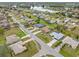 Beautiful aerial view of a quiet neighborhood with a scenic lake in the background on a bright day at 2149 Rio De Janeiro Ave, Punta Gorda, FL 33983