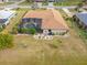 Aerial view of home with screened-in pool and manicured backyard, perfect for outdoor living at 2149 Rio De Janeiro Ave, Punta Gorda, FL 33983