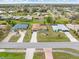 Spacious suburban neighborhood with manicured lawns and diverse home styles in an aerial view at 2149 Rio De Janeiro Ave, Punta Gorda, FL 33983