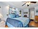 Bedroom with a ceiling fan, light blue walls, and access to the rest of the house at 2149 Rio De Janeiro Ave, Punta Gorda, FL 33983