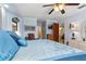 Bright bedroom with a large bed, ceiling fan, and light blue walls at 2149 Rio De Janeiro Ave, Punta Gorda, FL 33983