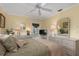 Bedroom with a ceiling fan, door to the outside, and light yellow walls at 2149 Rio De Janeiro Ave, Punta Gorda, FL 33983