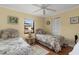 Bedroom featuring twin beds, ceiling fan and a closet at 2149 Rio De Janeiro Ave, Punta Gorda, FL 33983