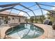 Backyard pool and spa with screen enclosure, offering a private oasis for swimming and sunbathing at 2149 Rio De Janeiro Ave, Punta Gorda, FL 33983