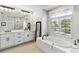 Bathroom with large soaking tub, double vanity, and separate shower at 2209 Calusa Lakes Blvd, Nokomis, FL 34275