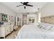 Bright bedroom with king-size bed and ensuite bathroom access at 2209 Calusa Lakes Blvd, Nokomis, FL 34275