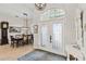 Formal dining room with a wooden table, chandelier, and hardwood floors at 2209 Calusa Lakes Blvd, Nokomis, FL 34275