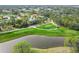 Aerial view of golf course with water features at 2209 Calusa Lakes Blvd, Nokomis, FL 34275