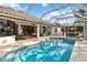 Inviting pool and spa with access to the home's interior at 2209 Calusa Lakes Blvd, Nokomis, FL 34275