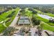 Aerial view of tennis courts with surrounding landscape at 2209 Calusa Lakes Blvd, Nokomis, FL 34275