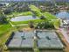 Aerial view of well-maintained tennis courts at 2209 Calusa Lakes Blvd, Nokomis, FL 34275