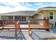 Elevated wooden deck with steps, offering backyard access at 22498 Westchester Blvd, Punta Gorda, FL 33980