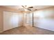 Bedroom with double doors closets and a ceiling fan at 22498 Westchester Blvd, Punta Gorda, FL 33980