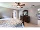 Main bedroom with a large bed and dresser at 22498 Westchester Blvd, Punta Gorda, FL 33980