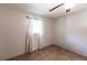 Well-lit bedroom featuring tiled floors and a window with curtains at 22498 Westchester Blvd, Punta Gorda, FL 33980