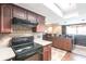 Kitchen with dark wood cabinets and tile flooring at 22498 Westchester Blvd, Punta Gorda, FL 33980