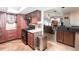 View of kitchen with dark wood cabinets and black appliances at 22498 Westchester Blvd, Punta Gorda, FL 33980