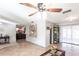 Living room with tile floors, large artwork, and a view of other rooms at 22498 Westchester Blvd, Punta Gorda, FL 33980