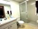 Bathroom with shower, toilet and vanity at 2395 Harbor Blvd # 324B, Port Charlotte, FL 33952