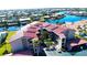 Aerial view of condo community, showing building, pool, and boat docks at 2601 W Marion Ave # 45C, Punta Gorda, FL 33950