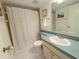 Clean bathroom with shower/tub combo, toilet, and vanity at 2601 W Marion Ave # 45C, Punta Gorda, FL 33950