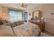 Bright bedroom with twin beds, dresser, and access to a balcony at 2601 W Marion Ave # 45C, Punta Gorda, FL 33950