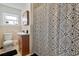 Bathroom with updated shower and a stylish black and white shower curtain at 312 E Tarpon Nw Blvd, Port Charlotte, FL 33952