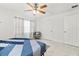 Bedroom with ceiling fan, large bed, and ample closet space at 312 E Tarpon Nw Blvd, Port Charlotte, FL 33952