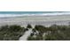 Private beach access path through dunes, leading to the ocean at 316 Antis Dr, Rotonda West, FL 33947