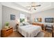 Main bedroom with king-size bed and ceiling fan at 316 Antis Dr, Rotonda West, FL 33947