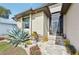 Welcoming front entrance with stone walkway and lush landscaping at 316 Antis Dr, Rotonda West, FL 33947