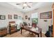 Bright home office with wood desk and leather chair at 316 Antis Dr, Rotonda West, FL 33947