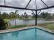 Enjoy the peaceful lake view from this relaxing pool area at 316 Antis Dr, Rotonda West, FL 33947