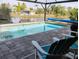 Enjoy serene lake views from this inviting poolside area at 316 Antis Dr, Rotonda West, FL 33947