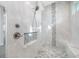 Large walk-in shower with bench and pebble floor at 3307 Dominica Ct, Punta Gorda, FL 33950