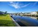 Scenic waterfront view with private dock and lush landscaping at 3307 Dominica Ct, Punta Gorda, FL 33950