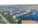 Aerial showing waterfront condos, pool, and boat docks at 3640 Bal Harbor Blvd # 313, Punta Gorda, FL 33950