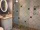 Bathroom with shower, vanity, and updated tile at 4127 Gardner Dr, Port Charlotte, FL 33952