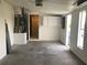 Spacious garage with storage cabinets and door at 4127 Gardner Dr, Port Charlotte, FL 33952