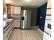 Bright kitchen with stainless steel refrigerator at 4127 Gardner Dr, Port Charlotte, FL 33952