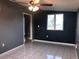 Living room with tiled floors, window and ceiling fan at 4127 Gardner Dr, Port Charlotte, FL 33952