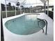 Relaxing kidney-shaped pool with a pool enclosure at 4127 Gardner Dr, Port Charlotte, FL 33952