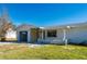 Front view of a single-story home with a stone accent wall at 414 Glenholm Ave, Punta Gorda, FL 33950