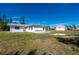 White house exterior with a large yard and another building in the background at 414 Glenholm Ave, Punta Gorda, FL 33950