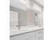 Double vanity bathroom with quartz countertop and large mirrors at 509 Sunset N Rd, Rotonda West, FL 33947